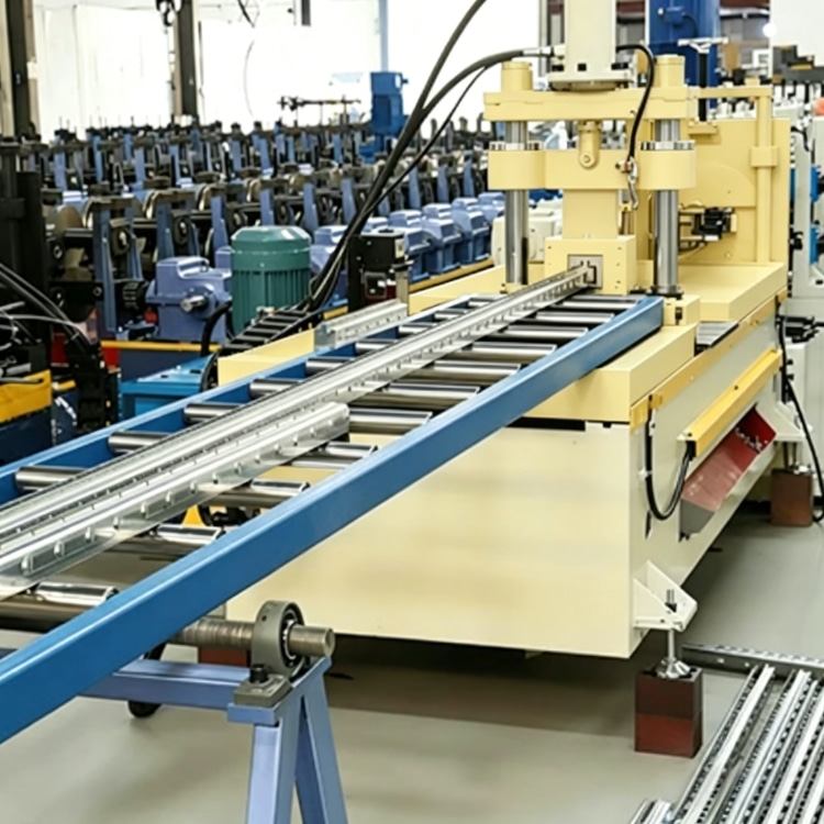 Shelf Rack Roll Forming Machine, a high-precision industrial equipment specialized in mass production of shelf rack uprights. The machine features a robust steel frame, integrated PLC control system with touchscreen interface, and multi-station forming rolls, showing its compact and professional structure. It is widely used in manufacturing high-quality structural components for industrial warehouses, commercial storage racks and logistics centers, with stable performance and high production efficiency.